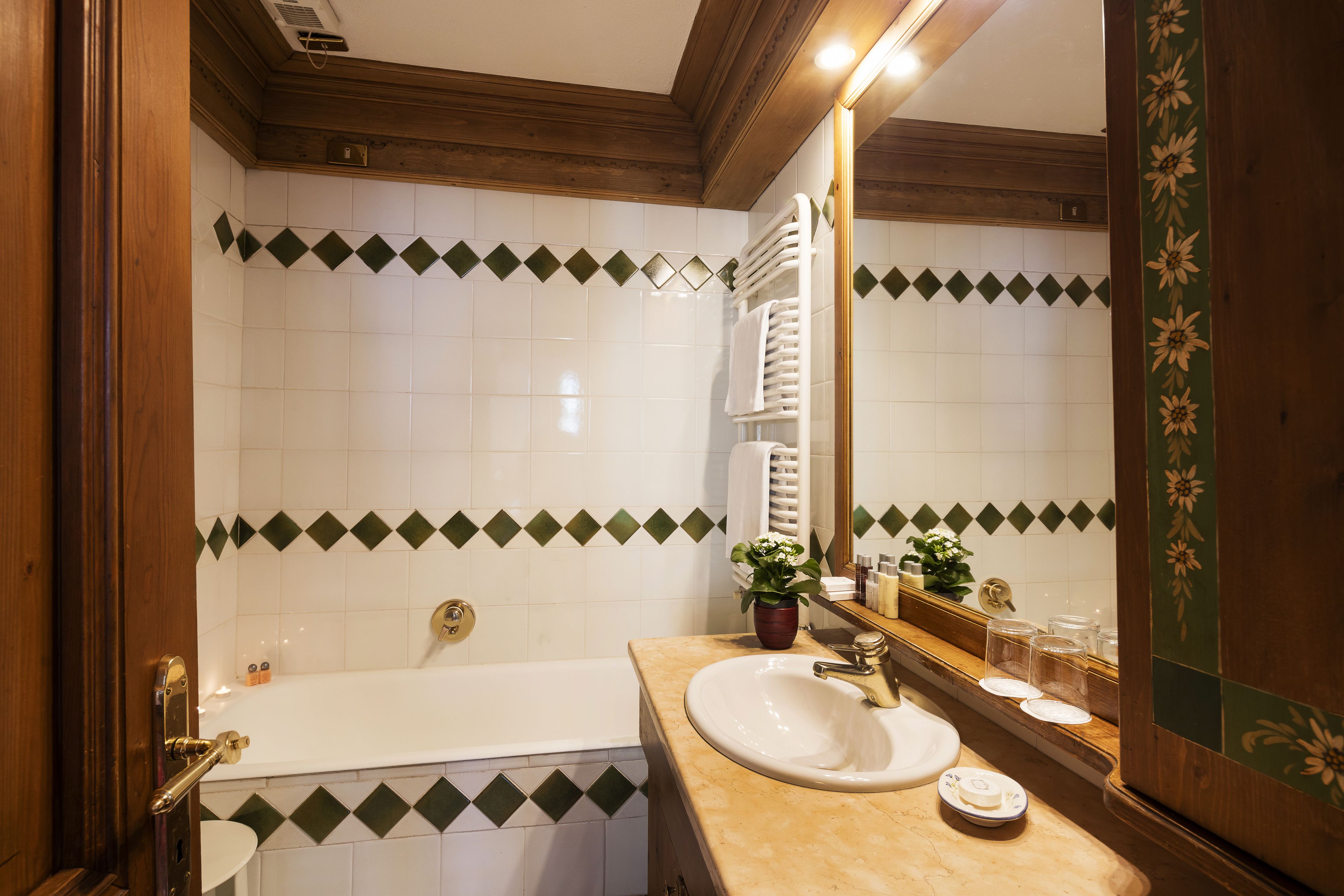 separate bathtub and shower, designer toiletries, hair dryer, slippers