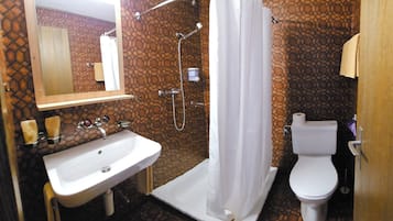 Shower, hair dryer, slippers, towels