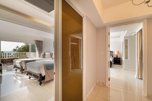 A hotel room with two beds, a balcony, and a view of the sea. - Thavorn Palm Beach Resort Phuket (Karon)