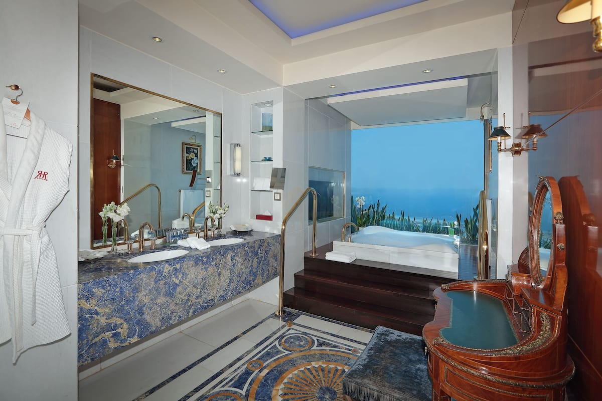 royal suite, 1 king bed | bathroom | designer toiletries, hair dryer, bathrobes, slippers