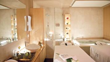 Relax in a serene space with a double bed, glass shower, and modern vanity.