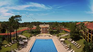 Indoor pool, outdoor pool, pool umbrellas