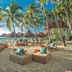 On the beach, white sand, sun loungers, beach umbrellas
