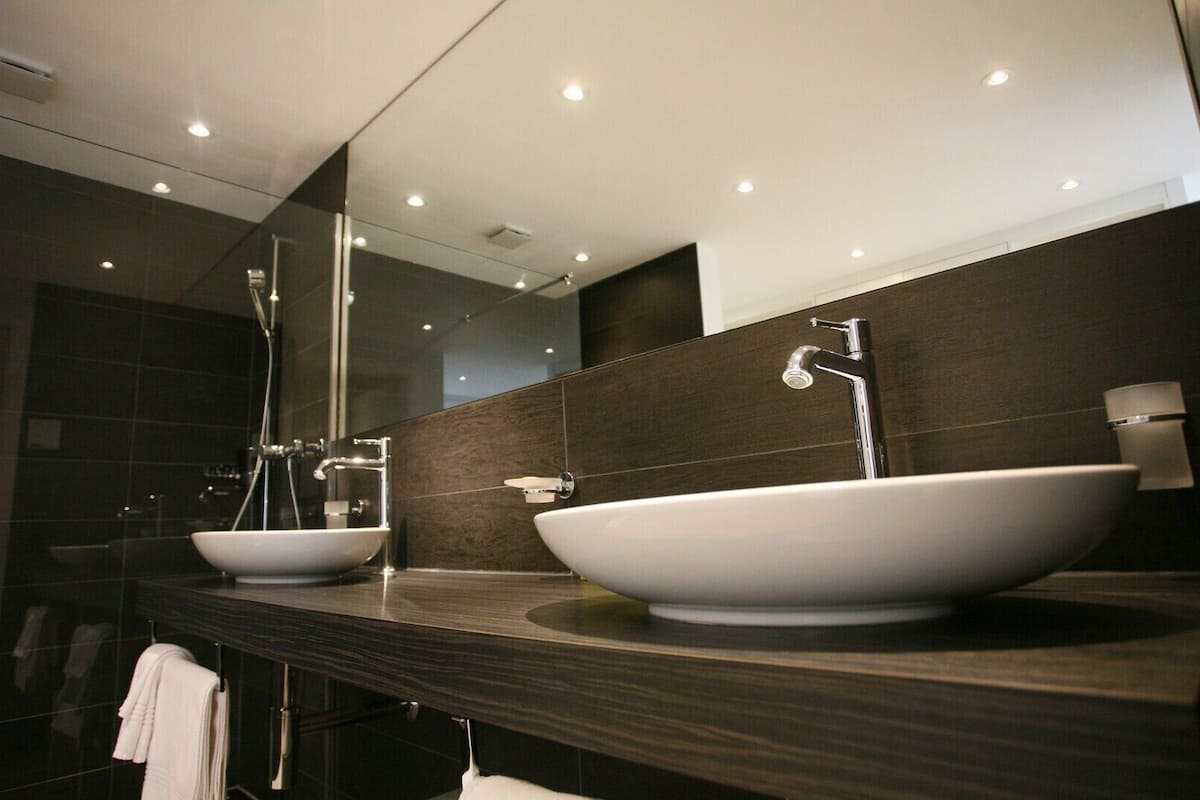 superior quadruple room | bathroom | shower, free toiletries, hair dryer, towels