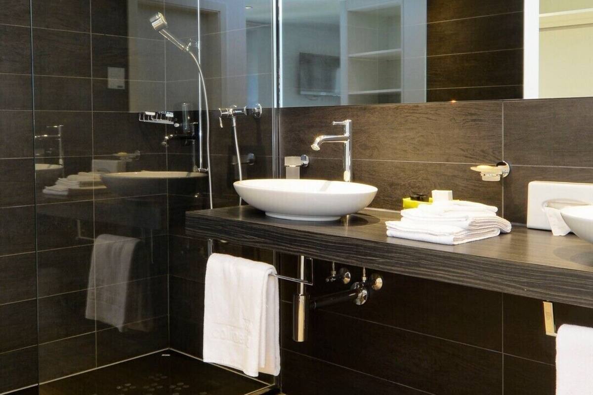 superior quadruple room | bathroom | shower, free toiletries, hair dryer, towels