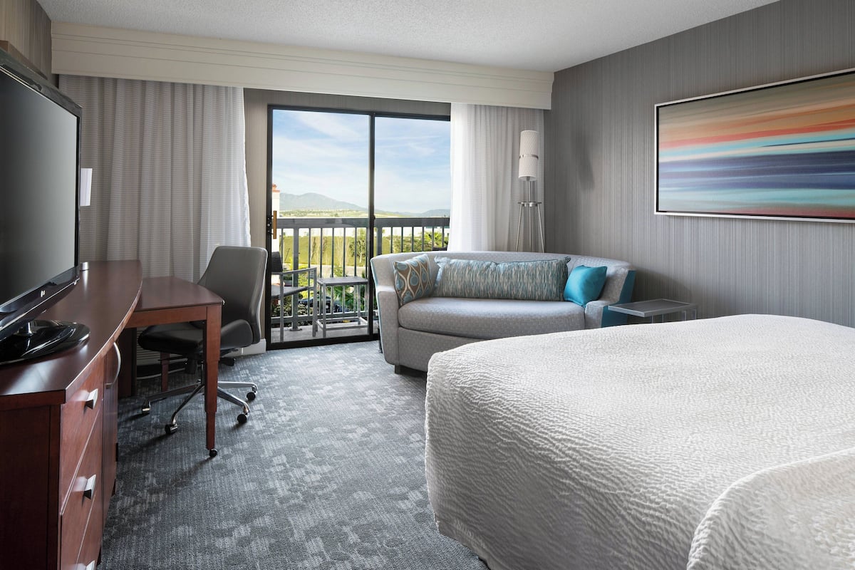 Room, 1 King Bed with Sofa bed, Non Smoking, Pool View (Balcony) | Premium bedding, in-room safe, desk, laptop workspace