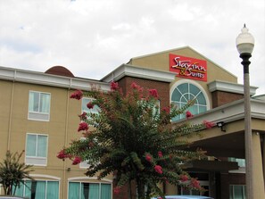 A hotel with a prominent sign reading "Stark & Suites".