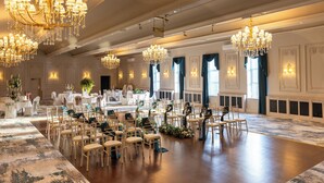 A spacious banquet hall with multiple chandeliers, white tables, and chairs arranged for a formal event. - The Roker Hotel, BW Premier Collection (Sunderland)
