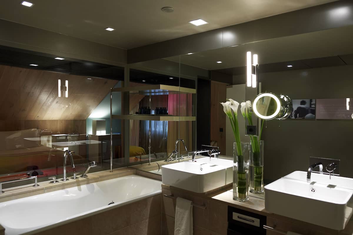 suite, 1 king bed, corner (opera) | bathroom | designer toiletries, hair dryer, bathrobes, slippers