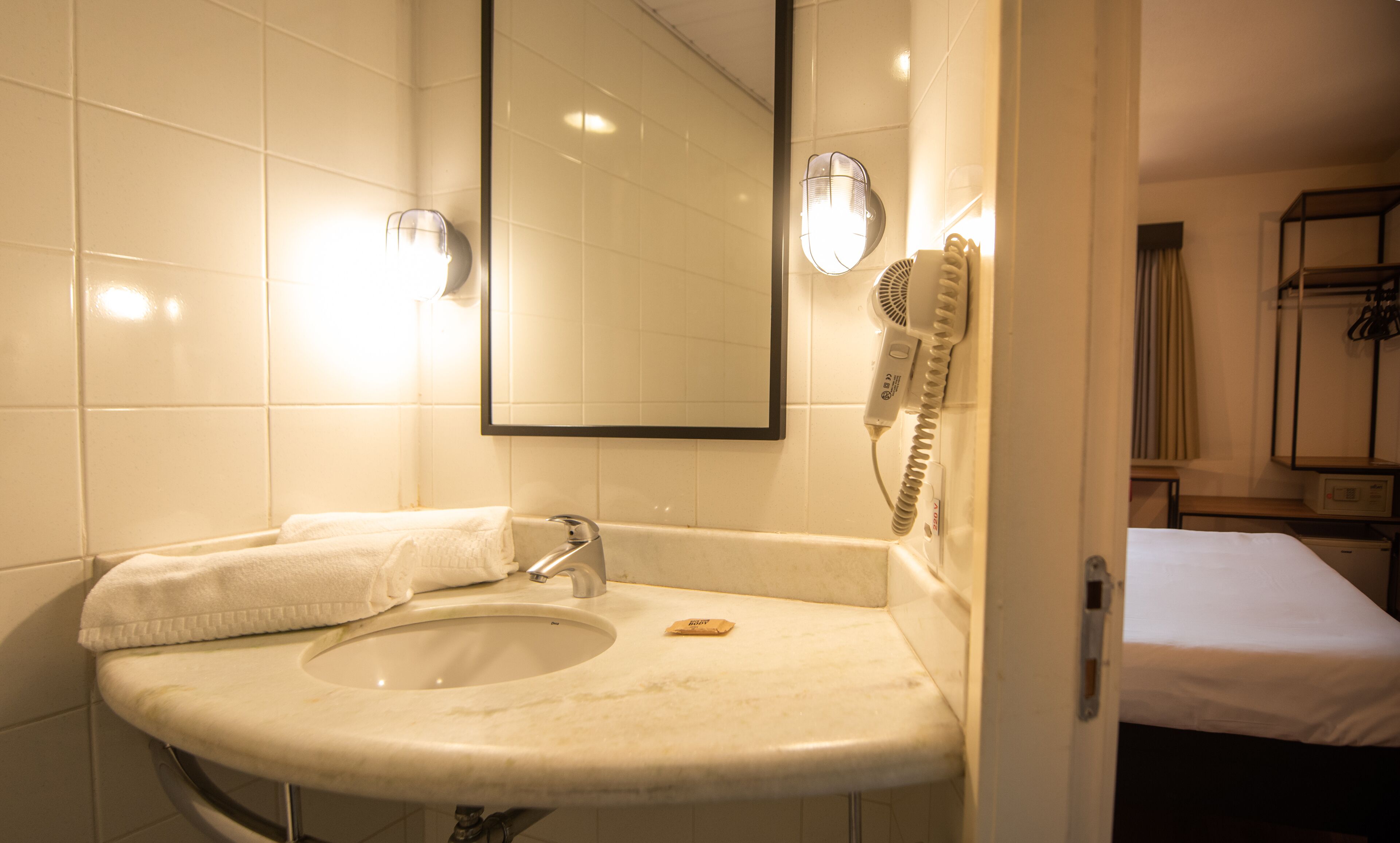 room, multiple beds | bathroom | shower, eco-friendly toiletries, hair dryer, towels