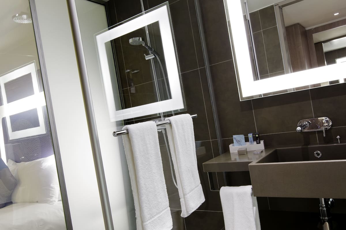 shower, eco-friendly toiletries, hair dryer, towels