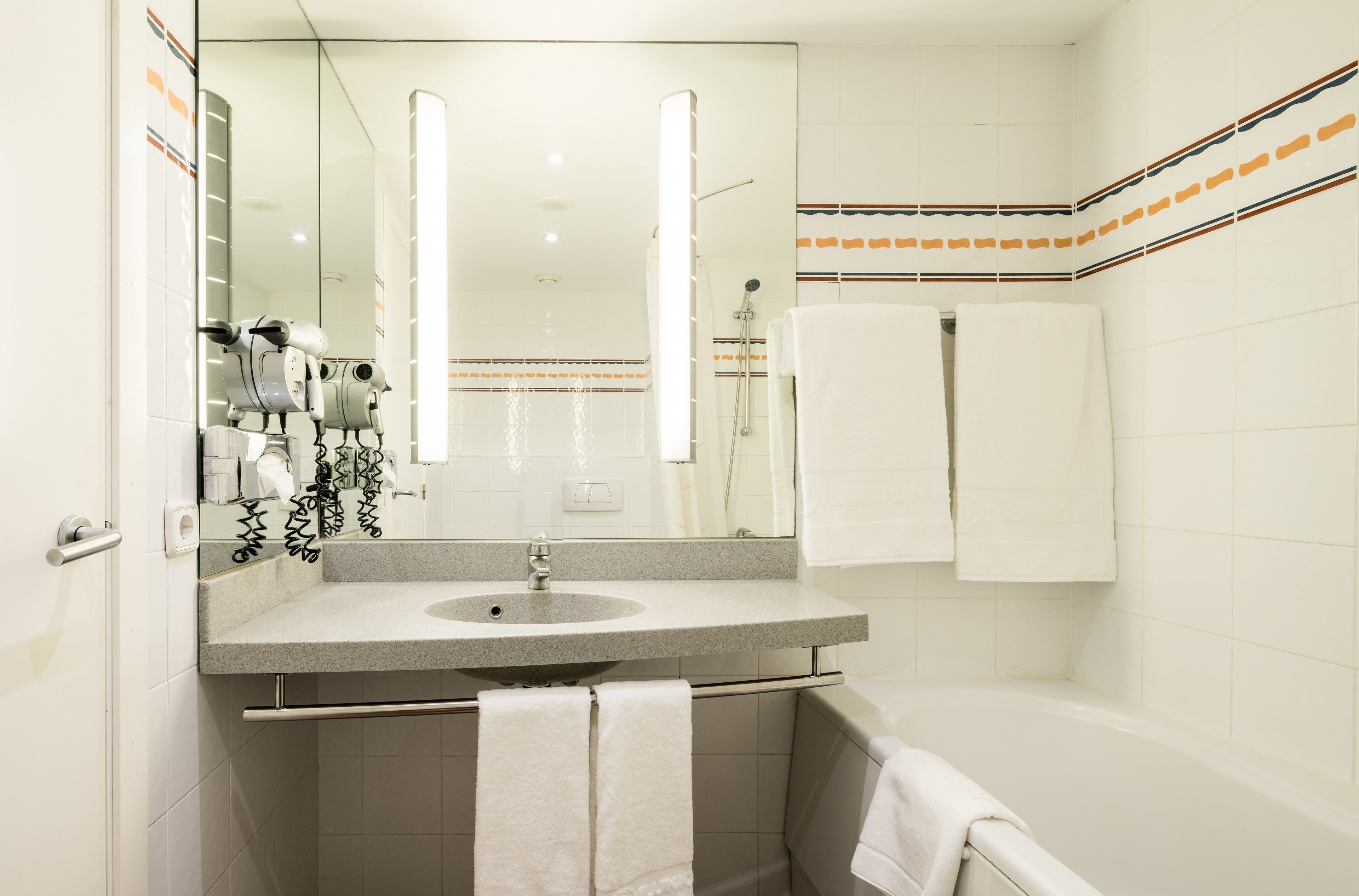 eco-friendly toiletries, hair dryer, towels, soap