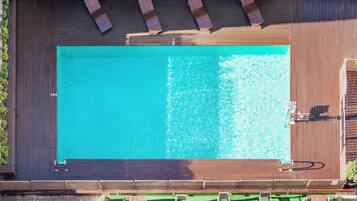 Seasonal outdoor pool, pool loungers