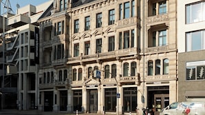 A historic building with ornate architectural details, multiple windows, and a prominent entrance. - Numa Berlin Checkpoint Charlie (Berlin)