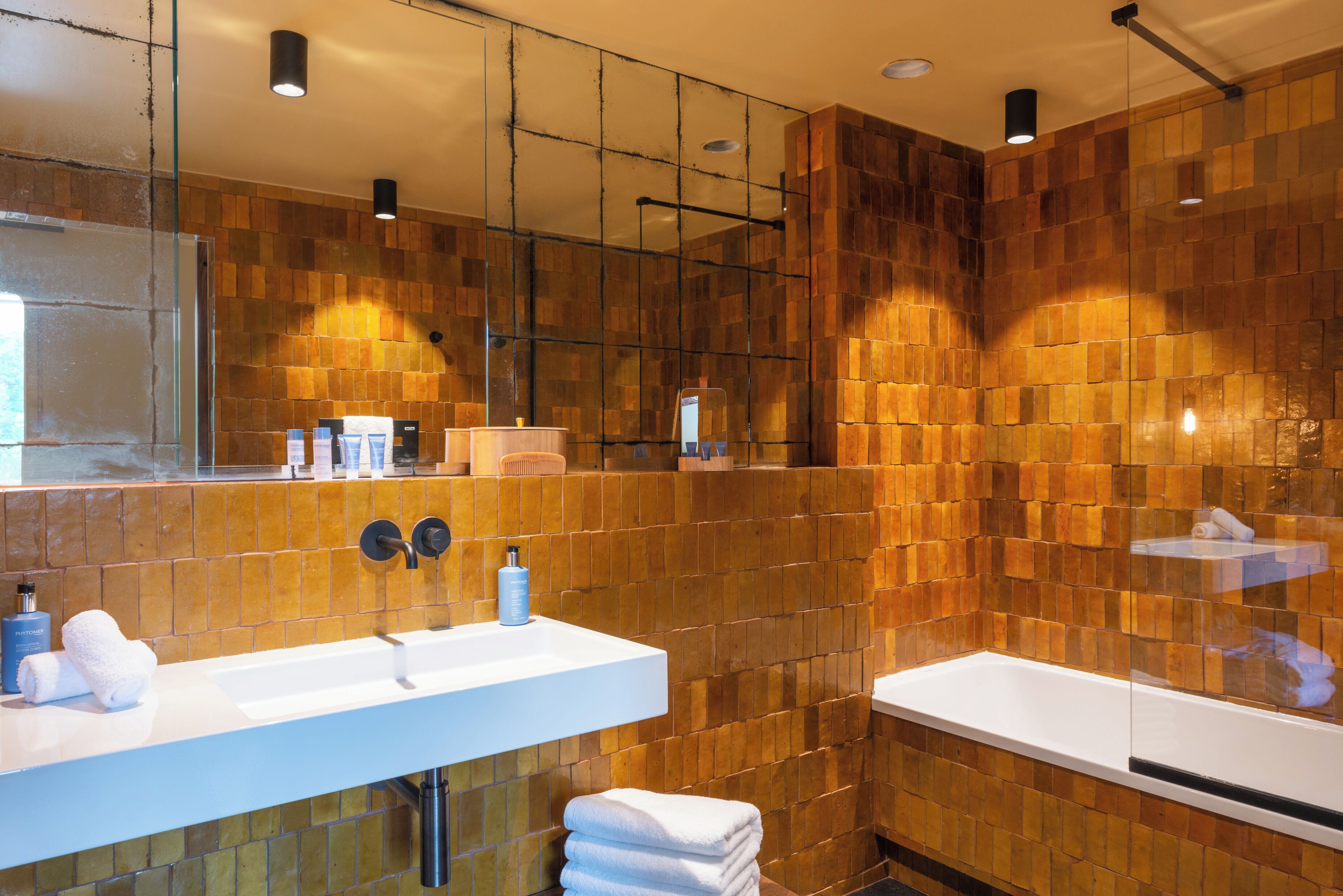 combined shower/bathtub, deep-soaking bathtub, designer toiletries