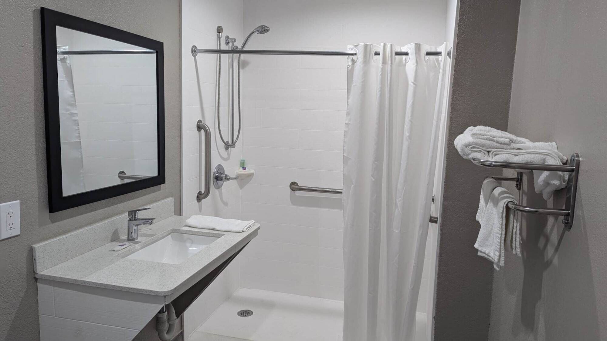 Combined shower/bathtub, towels, soap