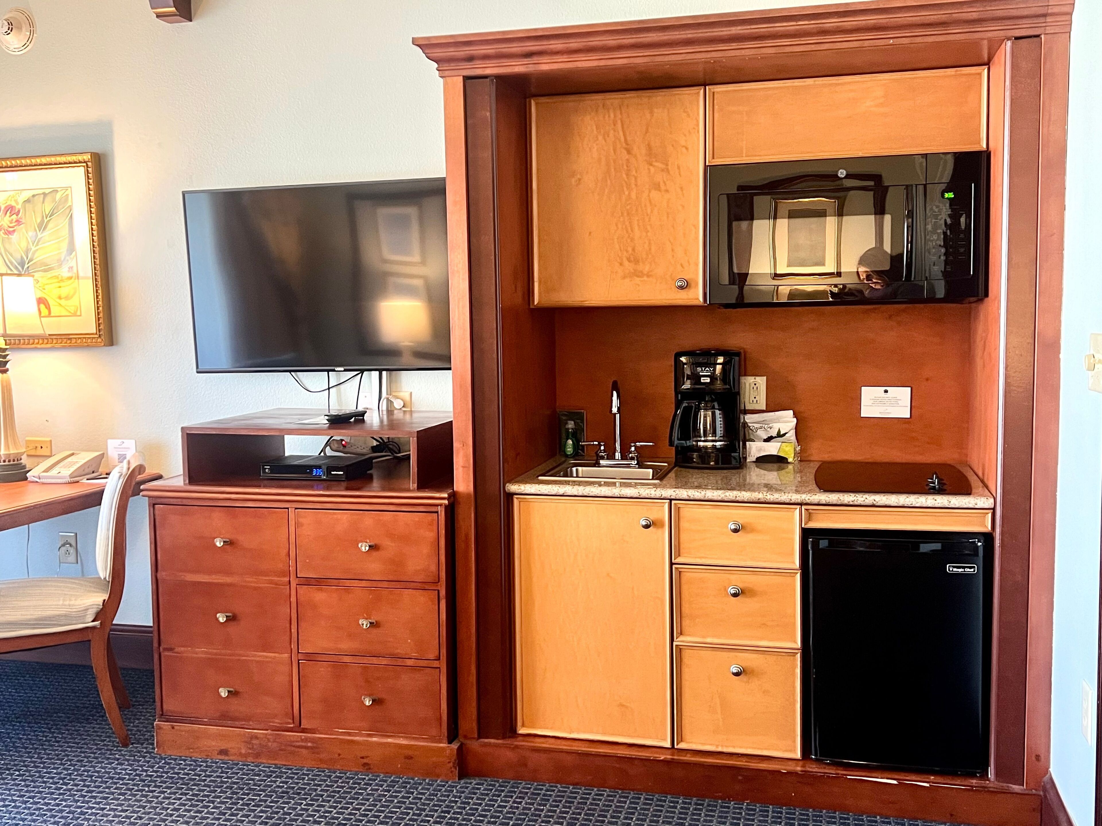 coffee/tea maker, cleaning supplies, paper towels