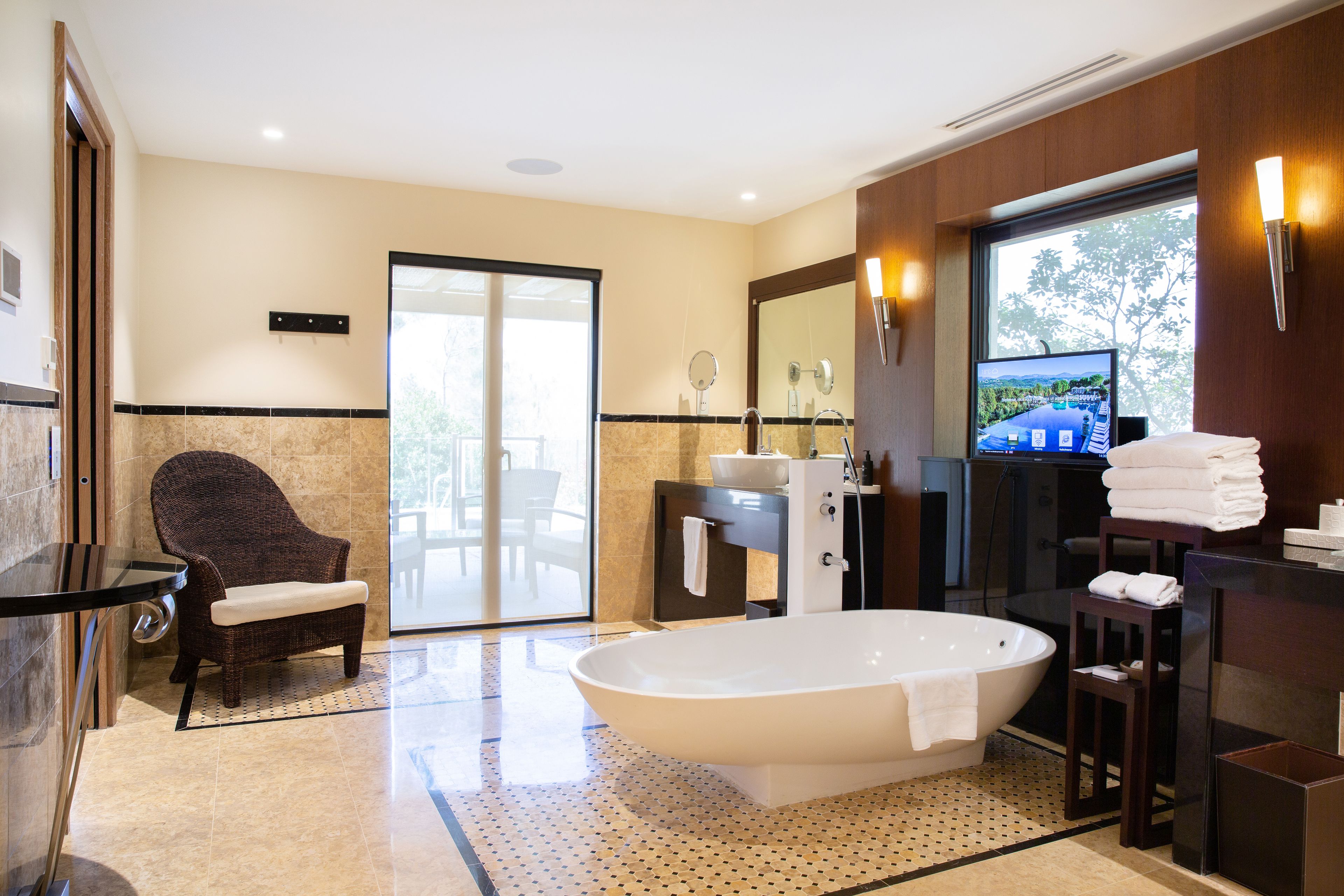 separate bathtub and shower, designer toiletries, hair dryer, bathrobes