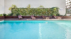 Seasonal outdoor pool, pool loungers