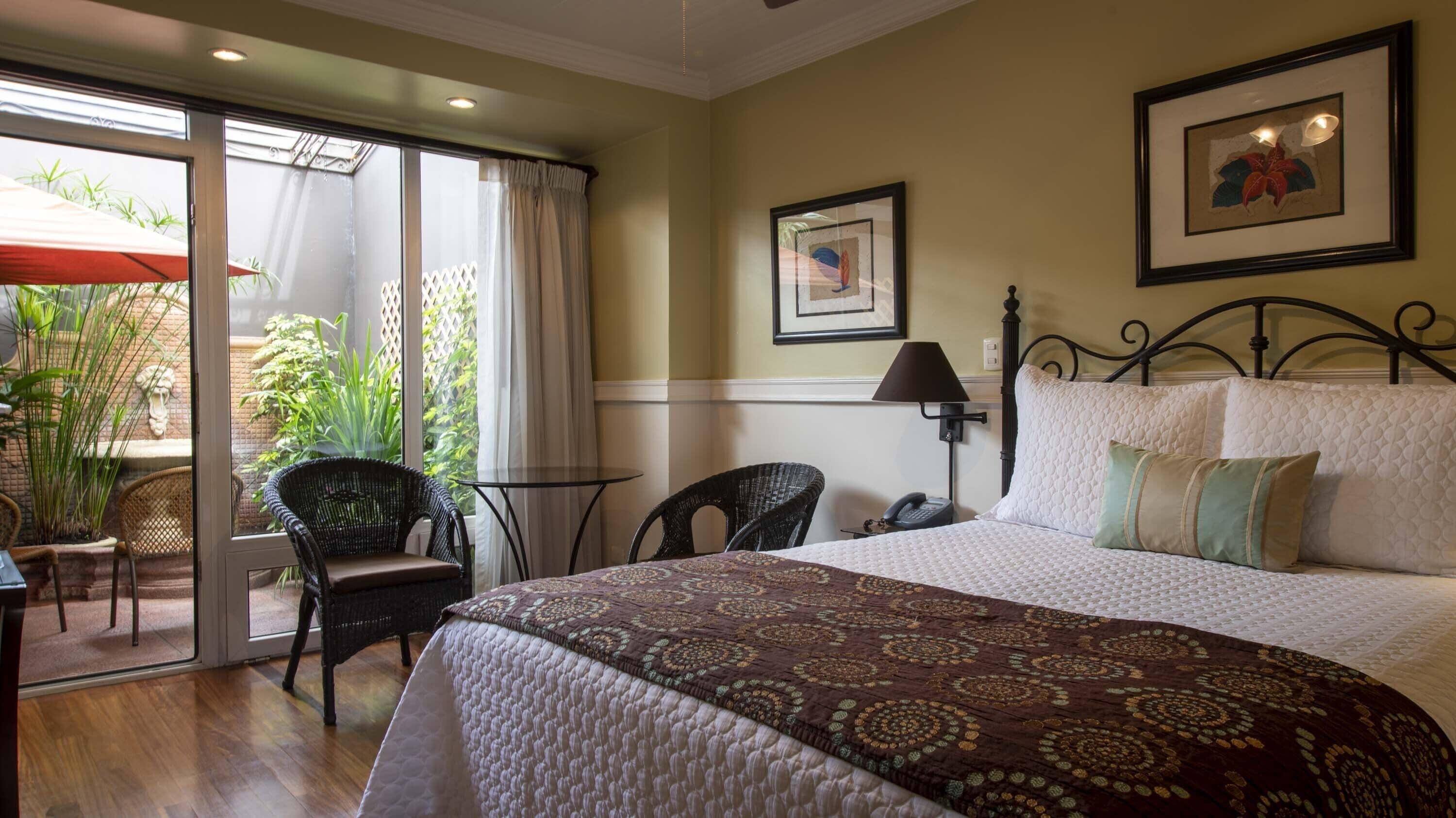 deluxe room, 1 queen bed, patio | premium bedding, pillow-top beds, minibar, in-room safe