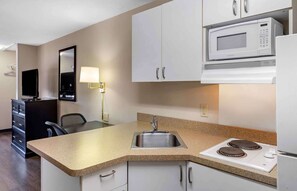 Full-sized fridge, microwave, cookware/dishes/utensils