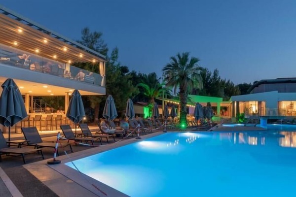 Seasonal outdoor pool, open 10:00 AM to 6:00 PM, pool umbrellas