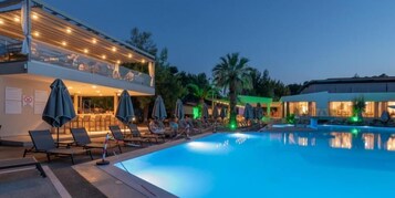 Seasonal outdoor pool, open 10:00 AM to 6:00 PM, pool umbrellas