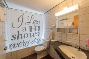 Single Room | Bathroom | Combined shower/tub, deep soaking tub, hair dryer, slippers