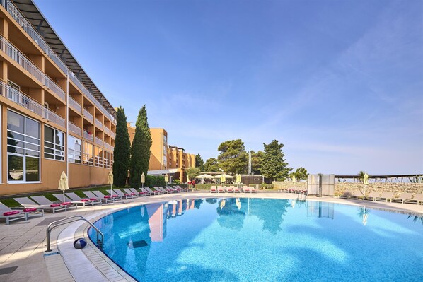 Indoor pool, seasonal outdoor pool, pool umbrellas, pool loungers