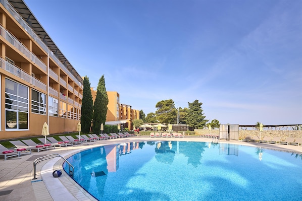 Indoor pool, seasonal outdoor pool, pool umbrellas, sun loungers