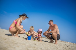 On the beach, sun loungers, beach umbrellas, beach volleyball