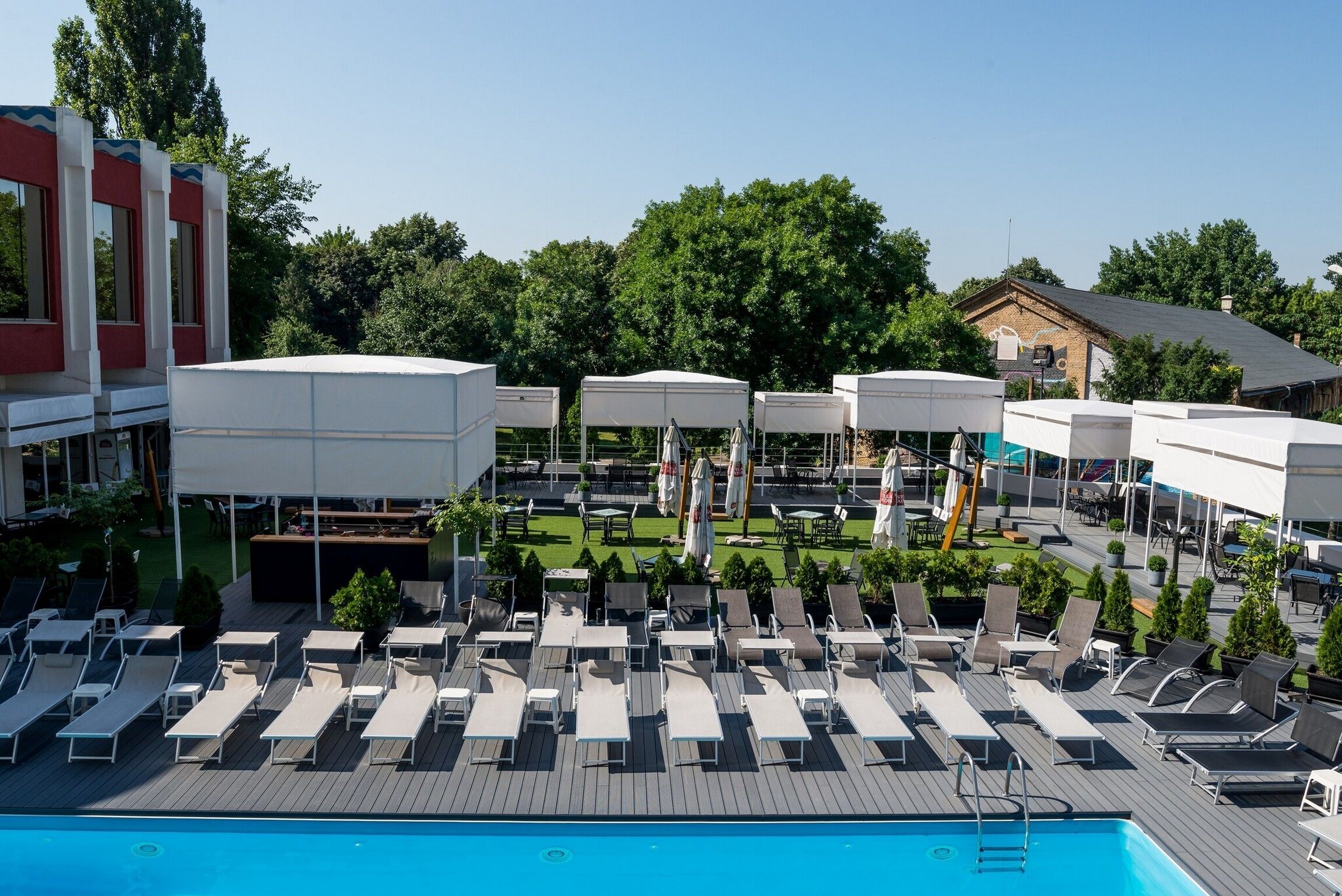 indoor pool, seasonal outdoor pool, pool umbrellas, pool loungers