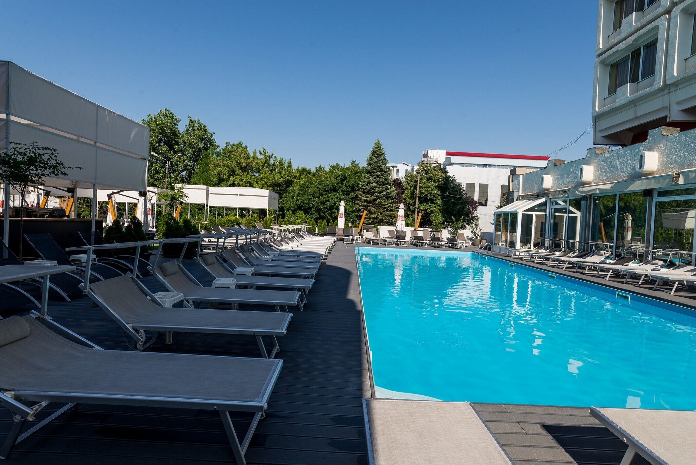 indoor pool, seasonal outdoor pool, pool umbrellas, pool loungers