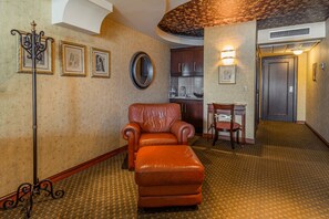 Superior King Suite | Living area | Flat-screen TV