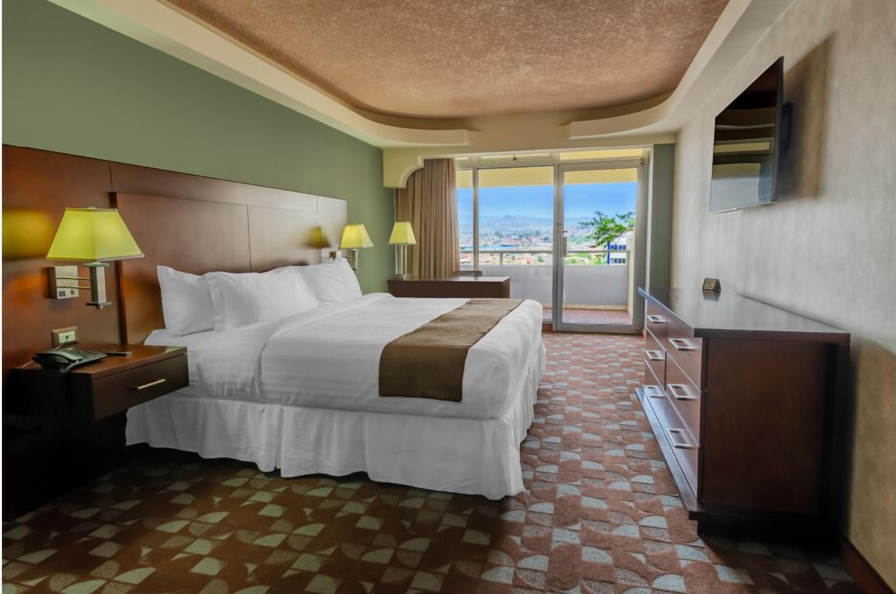 king room with balcony | 1 bedroom, premium bedding, in-room safe, desk