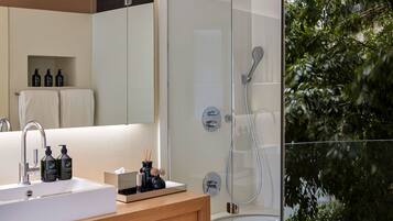 Designer toiletries, hair dryer, bathrobes, slippers