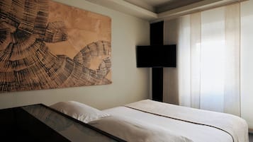 Premium bedding, down comforters, minibar, in-room safe