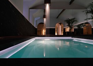 Indoor pool, open 8:00 AM to 10:00 PM, pool loungers