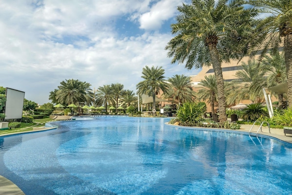 Outdoor pool, pool umbrellas, sun loungers