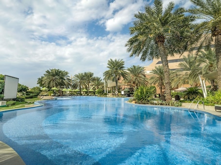 Outdoor pool, pool umbrellas, sun loungers