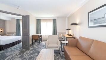 Deluxe Suite, 1 King Bed with Sofa bed, Kitchenette | 1 bedroom, desk, laptop workspace, blackout curtains
