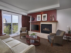 Suite, 1 King Bed | Living area | 42-inch flat-screen TV with cable channels, TV
