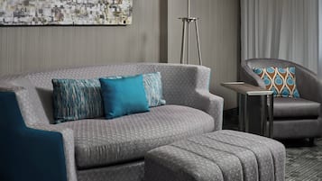 Suite, 1 Bedroom | Living area | 32-inch TV with cable channels