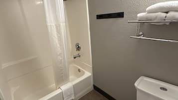 Combined shower/bathtub, rainfall showerhead, towels, toilet paper