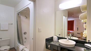 Combined shower/bathtub, towels, soap, shampoo