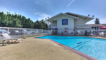Seasonal outdoor pool, open 9:00 AM to 9:00 PM, pool umbrellas