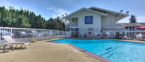 Seasonal outdoor pool, open 9:00 AM to 9:00 PM, pool umbrellas