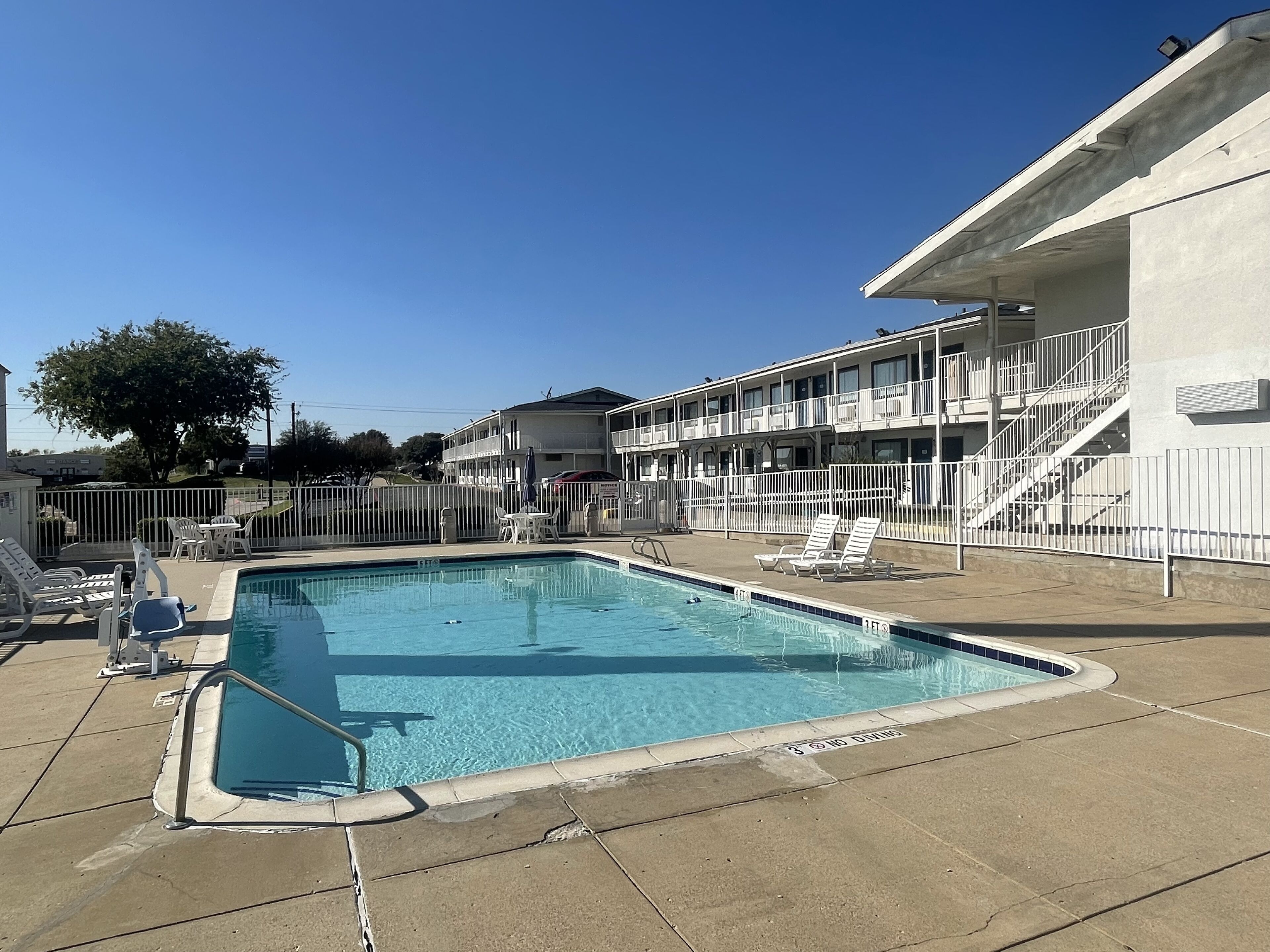 Outdoor pool, open 9:30 AM to 9:30 PM, pool loungers