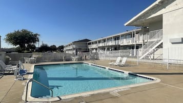 Outdoor pool, open 9:30 AM to 9:30 PM, pool loungers