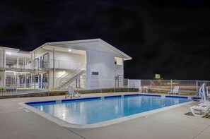 Outdoor pool, open 9:30 AM to 9:30 PM, pool loungers